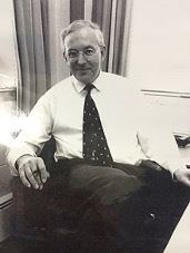 Black and white photo of Emeritus Professor John White 
